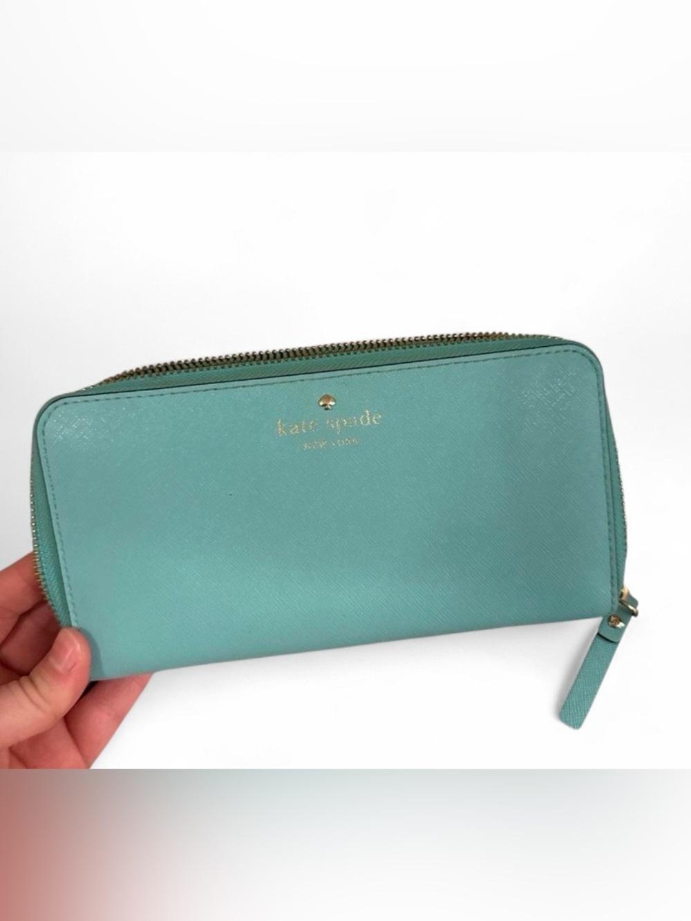 kate spade teal zip-around leather wallet with gold logo